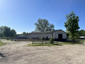 Sugar Creek Stable main barn on sunny day